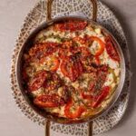 Baked feta with pepper, oil, oregano, and tomato